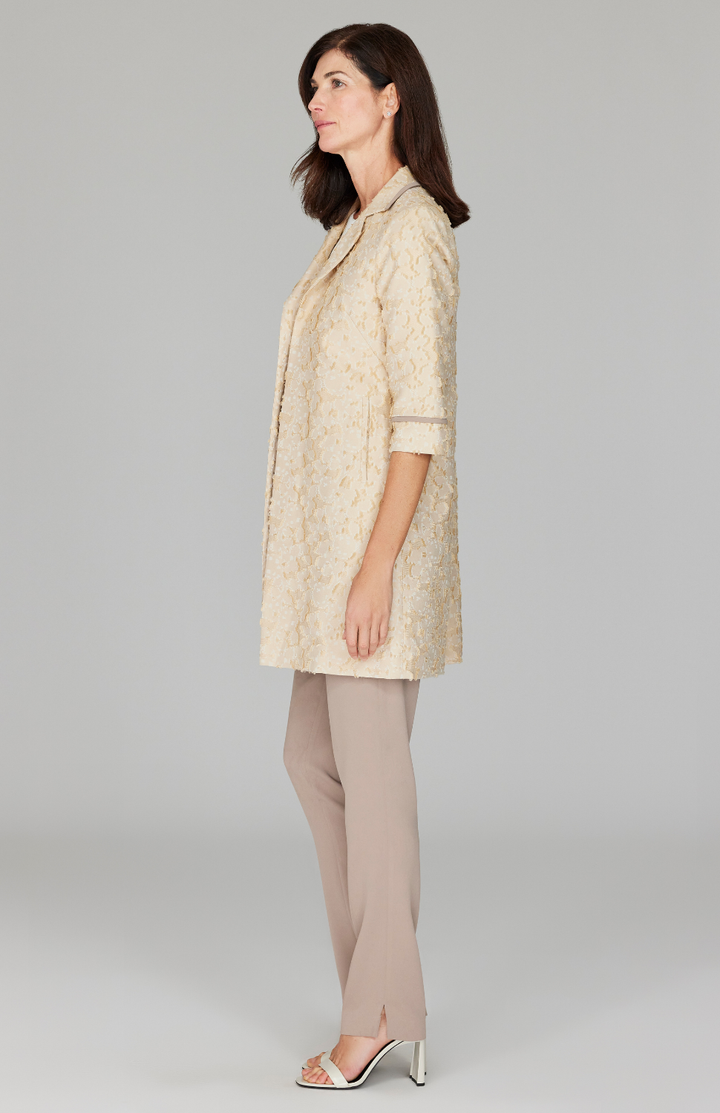 Ekaterina is 5'10" and wearing a size XS in Camel.