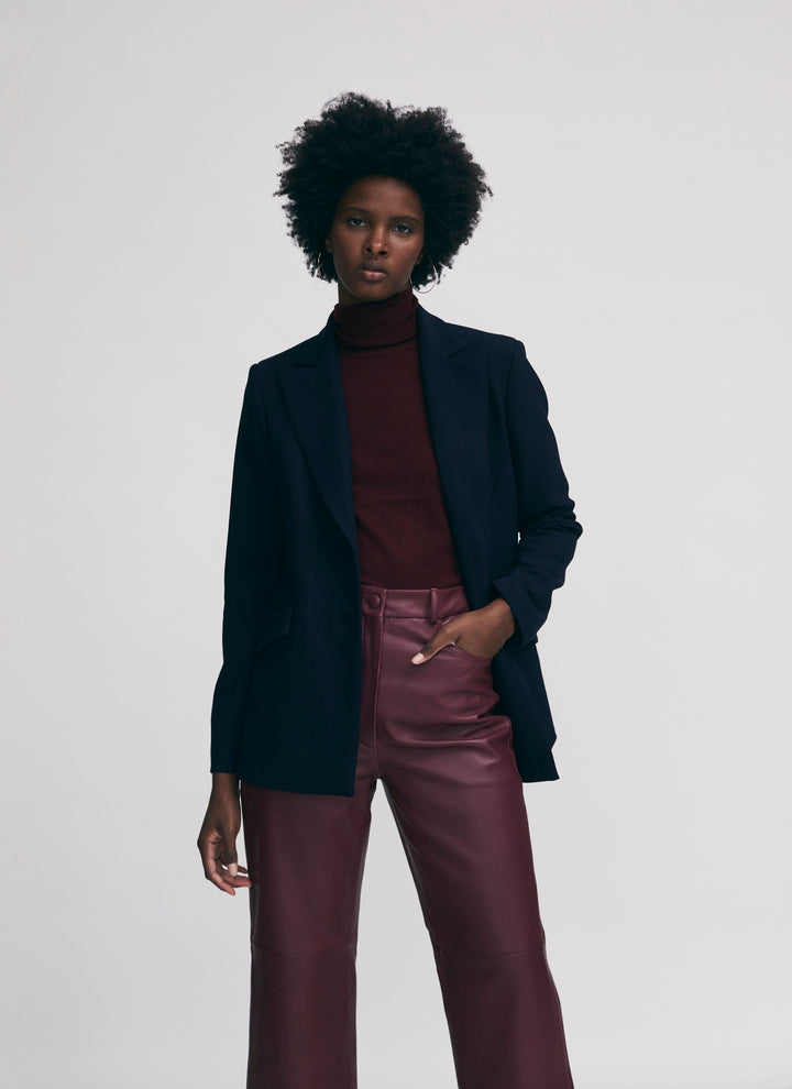 Straight leg leather trousers with cut at hem